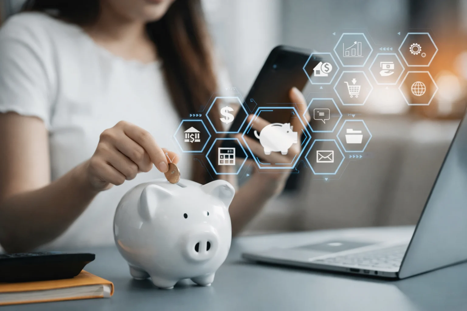 Piggy bank and laptop with budgeting icons representing the zero-based budgeting method