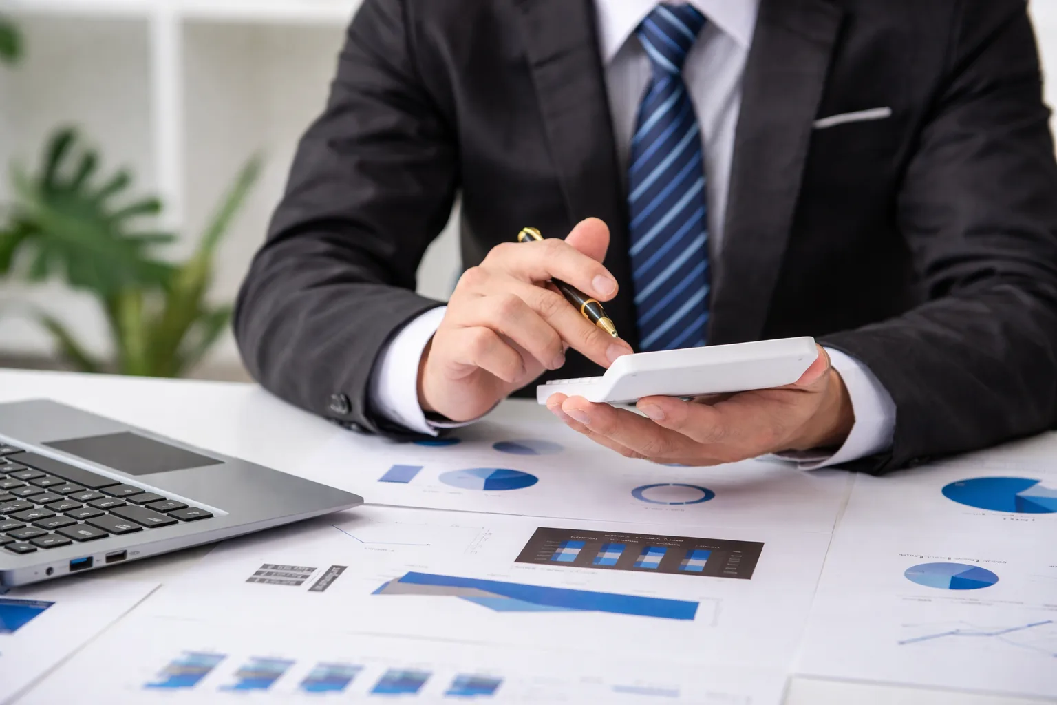 Financial advisor calculating mortgage refinance break-even point with charts and calculator