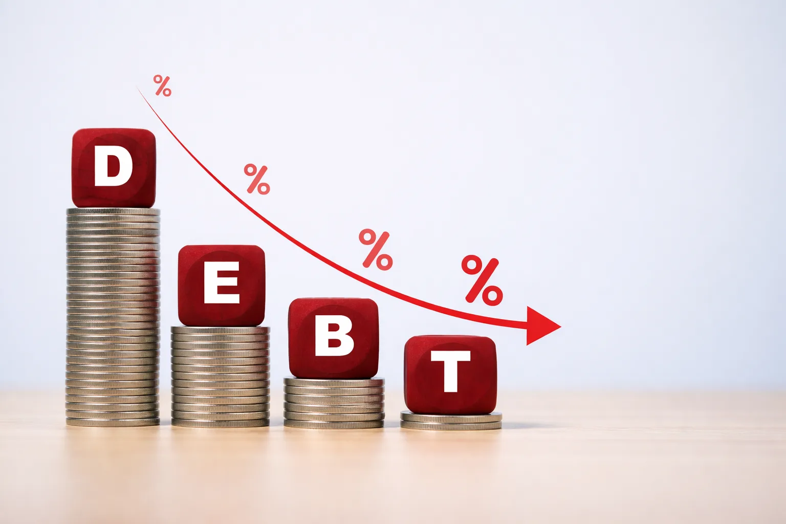 Debt blocks with decreasing arrow representing debt payoff strategy and reducing balances