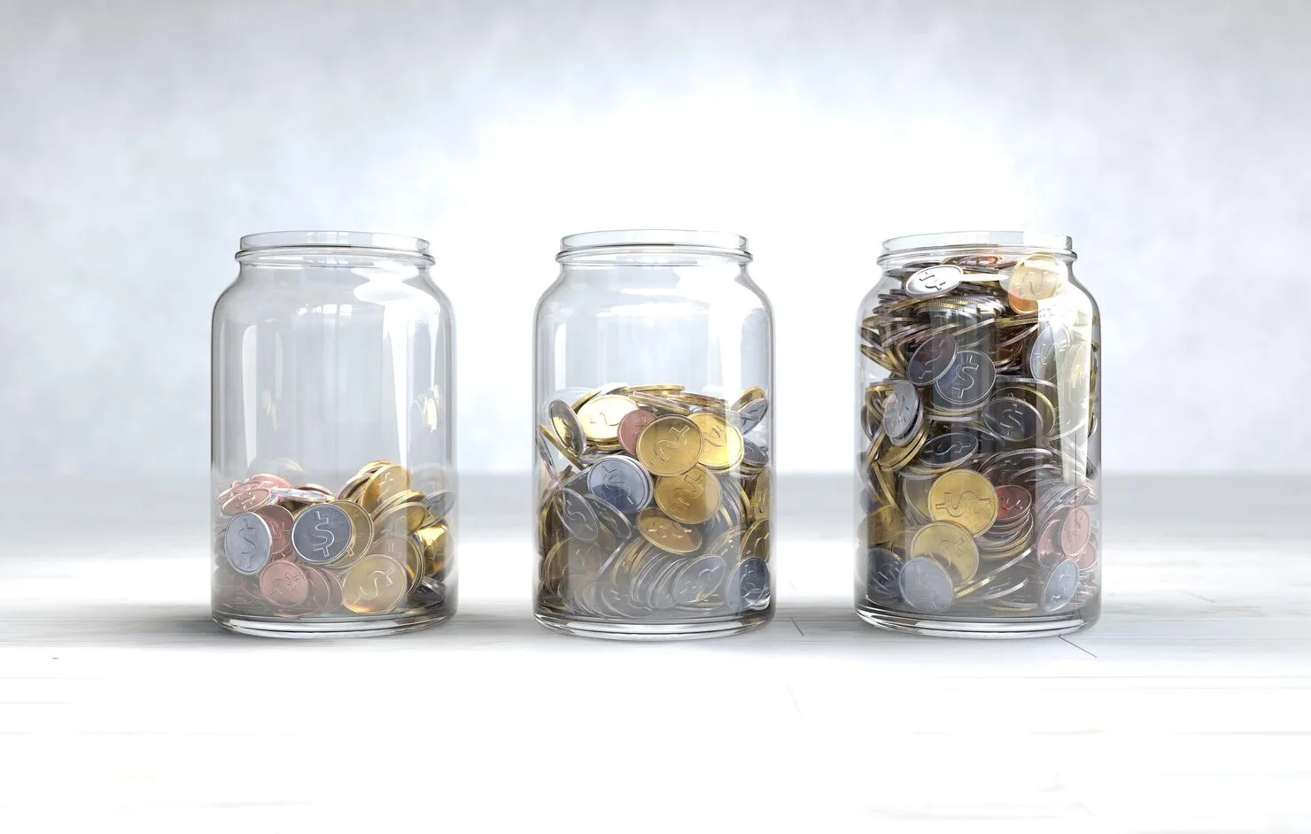 Glass jars with coins showing savings growth using a compound interest calculator